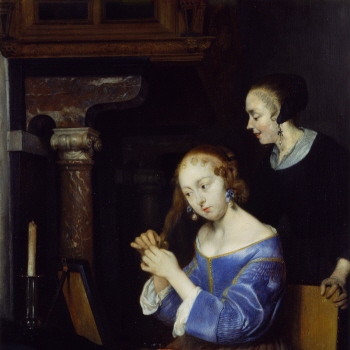 A Lady dressing her Hair
