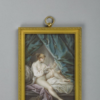 A nude woman on her bed
